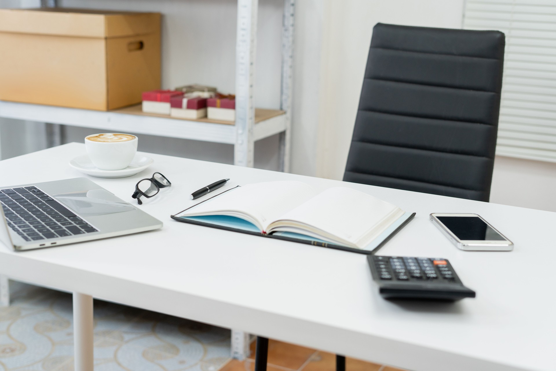 laptops, books, and coffee fueling productivity in a modern office space designed for efficiency and creativity.
