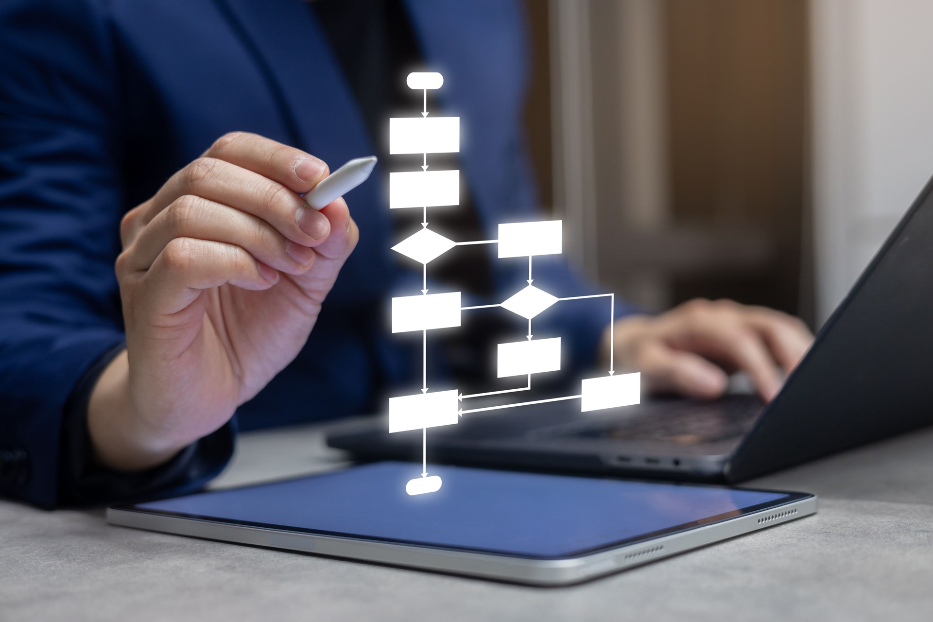 close up entrepreneur businessman hand use stylus pen to write and check about progress or procedure of strategy and resolving with virtual flowchart diagram for business planning and performance concept